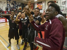 Edmonton Archbishop O'Leary celebrated its overtime victory against the Winnipeg Garden City Collegiate Fighting Gophers in the 2016 Bedford Road Invitational Tournament (BRIT) final