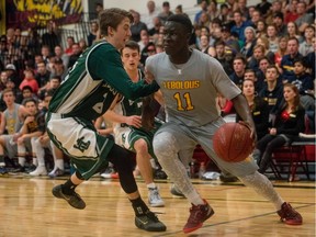 Chan DeCiman drives the net during the 2015 BRIT final between Dr. Martin LeBoldus and Holy Cross