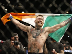 Conor McGregor reacts after defeating Jose Aldo during a featherweight championship mixed martial arts bout at UFC 194, Saturday, Dec. 12, 2015, in Las Vegas.