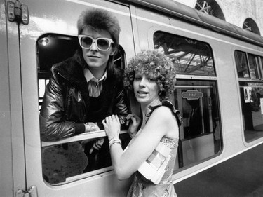 July 1973:  Pop singer David Bowie is seen off at the station by his wife Angie.