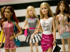 In this Sept. 29, 2015, file photo, Barbie Fashionista Dolls from Mattel are displayed at the TTPM Holiday Showcase in New York.