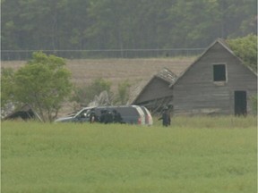 Members of the RCMP's Emergency Response Team moved towards a building where Peter Robert Whitmore, 10-year-old Zach Miller and a 14-year-old boy were inside in August 2006