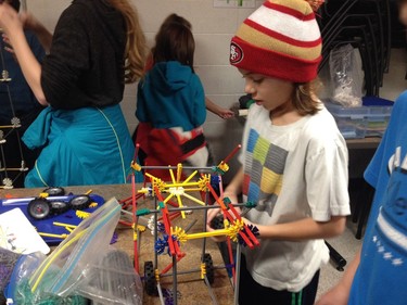 Grade 4 students Elliot Scott, in red, and Liam Kosokowsky, in blue, from Holy Family Catholic School, experiment at the K'NEX station at Cameco Spectrum 2016.
