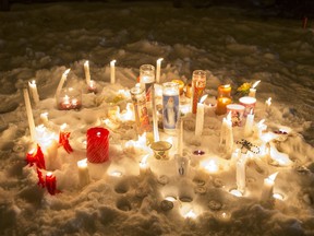 La Loche - A collection of candles from a vigil near where RCMP are on the scene after a school shooting at La Loche Community School on Friday, January 22nd, 2016.