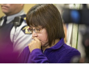 MP Georgina Jolibois listens during a media event at La Loche court house the day after a series of shootings left four people dead on Friday, Jan. 22, 2016.