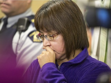 Local MP Georgina Jolibois listens during a media event at La Loche court house after Friday's school shooting at La Loche Community School on January 23, 2016.