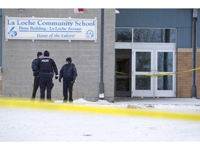 A memorial sits outside of the La Loche Community School on April 26, 2016. A teen, who cannot be named under the Youth Criminal Justice Act, pleaded guilty in October to two counts of second-degree murder in the deaths of brothers Dayne and Drayden Fontaine, two counts of first-degree murder in the deaths of teacher’s aide Marie Janvier and teacher Adam Wood, and seven counts of attempted murder. His sentencing hearing is underway in Meadow Lake provincial court.