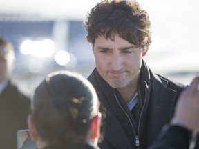 Prime Minister Justin Trudeau is greeted by people from La Loche after arrive at the airport on Friday, January 29th, 2016.