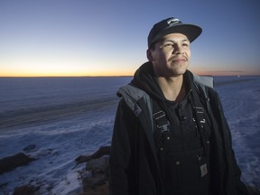 La Loche resident Aaron Herman, who released a tribute rap for the victims of the La Loche school shooting, poses for a photograph near La Loche Lake on Friday, January 29th, 2016.