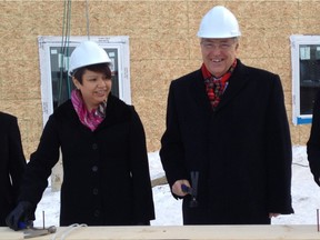 Minister of Central Services Jennifer Campeau and Saskatoon Mayor Don Atchison at Camponi housing announcement.