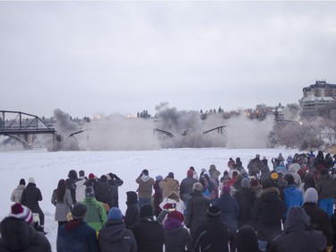 The first two sections of the Traffic Bridge are demolished with explosives on  January 10, 2016.