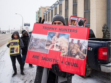 Protesters can be seen outside of the Travelodge on Circle Drive West on Saturday morning. The group was protesting an event held by African Events Canada which saw roughly 25 different exhibiters at the Travelodge, including 22 outfitters selling photographic, hunting and fishing safaris.
