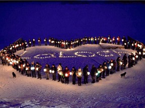 Residents of Stanley Mission, a northern Saskatchewan community, came together for a candle light vigil tonight and sent a special message to La Loche, where Friday's shooting killed four people. Prestin Mercredi-Fleming took these photos and shared them on Facebook.
