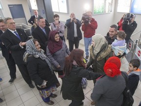 Syrian refugee families are welcomed at the Saskatoon airport in December.