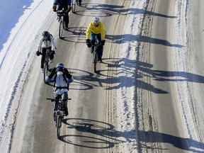 Cyclist basked in the sun shine which cast long shadows during the Ride Cycle event through downtown Saskatoon was well attended despite the cold temperatures, Feb. 7, 2010.