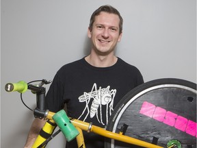 Will Robbins poses for a photograph with his bicycle and bike polo mallet at his home on  Jan 2, 2016. Robbins will be traveling to New Zealand this month to referee an international bike polo tournament.
