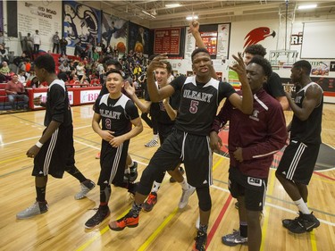 The Archbishop O'Leary Spartans celebrate their championship win over the Garden City Collegiate Fighting Gophers at the annual BRIT basketball classic, January 9, 2016.