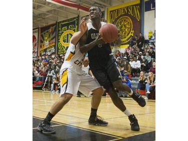 Archbishop O'Leary Spartans' Jamal Hinds goes in for a lay up against the Garden City Collegiate Fighting Gophers at the annual BRIT basketball classic, January 9, 2016.