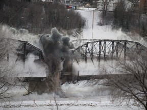 The first two sections of the Traffic bridge are demolished by explosives on Sunday, January 10th, 2016.