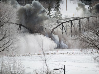 The first two sections of the Traffic Bridge are demolished with explosives on  January 10, 2016.