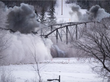 The first two sections of the Traffic Bridge are demolished with explosives on  January 10, 2016.