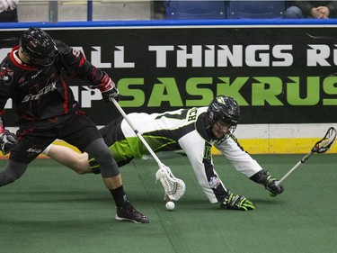 Saskatchewan Rush #17 Robert Church is knocked down by a Stealth player chasing the ball against the Vancouver Stealth in the Rush's first game at SaskTel Centre bringing national league lacrosse to Saskatoon, January 15, 2016.