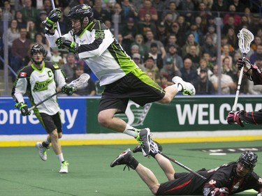 Saskatchewan Rush #33 John LaFontaine leaps at the Vancouver Stealth goalie with a shot in the Rush's first game at SaskTel Center bringing national league lacrosse to Saskatoon, January 15, 2016.