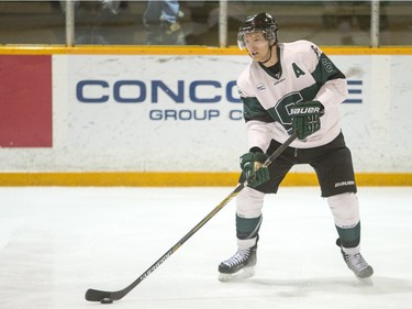 University of Saskatchewan defence Jordan Fransoo moves the puck against the University of Calgary Dinos in CIS men's hockey action, January 16, 2016.