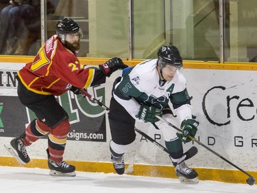 University of Saskatchewan defence Jesse Forsberg moves the puck against the University of Calgary Dinos in CIS men's hockey action, January 16, 2016.