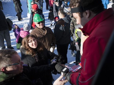 Audrey Wasylyk (left) waits in line to meet Rick Mercer during the world record attempt for the largest snowball fight on Sunday, Jan. 31, 2016.