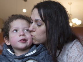 Sylvie Fortier-Kot and her son, Kayden at their home. Kayden has now been approved for a $14,000 medical treatment in Denver.