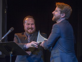 Andrew Taylor, right, and Donovan Scheirer, of Two Unruly Gentlemen, which produced Two Corpses go Dancing, accept the award for Outstanding Ensemble during  the 2015 Saskatoon Theatre Awards.