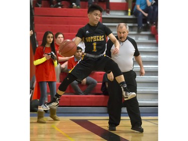 Christian De Leon of the Garden City Fighting Gophers saves the ball from going out of bounds during opening game action in the annual BRIT basketball classic, January 7, 2016.