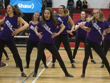 Members of the Red Blue Dance Crew on the court during opening game action in the annual BRIT basketball classic, January 7, 2016.