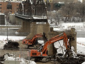 Crews continue to tear apart the southernmost spans of the Traffic Bridge Tuesday after they were removed using explosives Sunday morning.  Almost all of the 830 tonnes of material will be recycled.