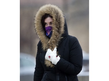 Pedestrians in Saskatoon were bundled up for the extreme wind chill and snow in the city,  Monday, January 18, 2016.