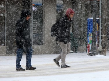 Pedestrians in Saskatoon were bundled up for the extreme windchill and snow in the city, January 18, 2016.