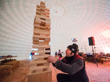 Andrew Glendenning plays giant Jenga in the Igloo at the PotashCorp Wintershines Festival in Saskatoon, January 23, 2016.