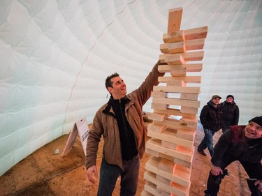 James Bykowy plays giant Jenga in the Igloo at the PotashCorp Wintershines Festival in Saskatoon,  January 23, 2016.