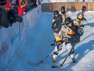 Members of the Saskatoon Aces Cyclones and Bulldogs participate in the Aces Winter Classic in Saskatoon, January 23, 2016.