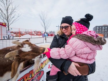 Rachel Martz and Farrah Fettis visit the petting zoo at the PotashCorp Wintershines Festival in Saskatoon, January 23, 2016.