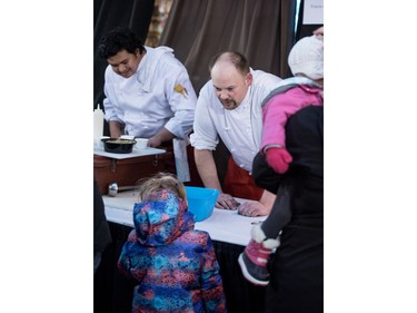 Guests try soups from a variety of Chefs at the Warm The Heart Novice Chef Soup Cook-Off in the Saskatoon Farmers' Market at the PotashCorp Wintershines Festival, January 24, 2016.