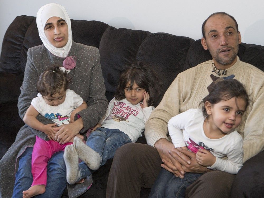 Father Basem Husain Ahmad and mother Fadi Al Masalma are refugees from Syria and spoke to media with their three children, Taima Basem Ahmad (4 1/2), middle, Bara'A Basem Ahmad, and Rehal Basam Ahmad (youngest at left) in Saskatoon, Friday, Jan. 29, 2016.