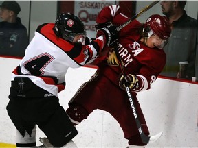 File Photo. Brady Anderson of the visiting Regina Storm, right, mixes it up with Cody Pettapiece of the Saskatoon Quakers in Prairie Junior Hockey League action at Latrace Arena, March 31, 2015.