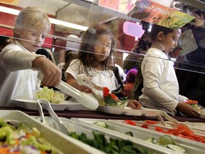 Students at a Chicago elementary school dig into a salad bar that's part of a lunch program.