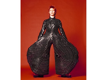 David Bowie in a striped bodysuit for the Aladdin Sane tour in 1973. The jumpsuit was designed by Kansai Yamamoto.