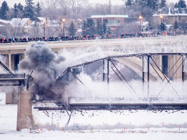 The south two spans of the historic Traffic Bridge, Saskatoon's first vehicle bridge, are demolished on January 10th, 2016. Photo taken with a remote camera.