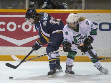 University of Saskatchewan Huskies forward Kaitlin Willoughby battles for the puck with University of Lethbridge Pronghorns forward Tricia Van Vaerenbergh in CIS women's hockey action at Rutherford Rink, January 9, 2016.