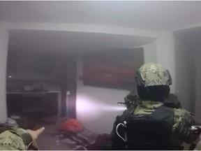 Screen grab from a handout video taken on January 8, 2016 and released by the Mexican Navy showing marines assaulting a house during the operation to recapture Mexico's most wanted drug kingpin, Joaquin "El Chapo Guzman" Guzman in Los Mochis, Mexico.