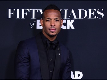 Marlon Wayans poses upon arrival for the premiere of "Fifty Shades of Black" in Los Angeles, California, January 26, 2016.